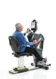 SCIFIT PRO2 Sport Total Body Ergometer with standard seat. Older male model using machine for full-body rehab and cardio fitness.