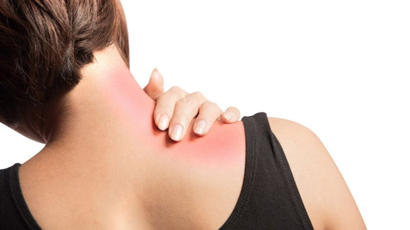Woman Rubbing Neck From Muscle Knot Pain
